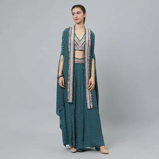 TEXTURED CROP TOP TEAMED WITH EMBELLISHED BLUE BUTTI PRINT BOX PLEAT PANTS HIGHLIGHTED CAPE