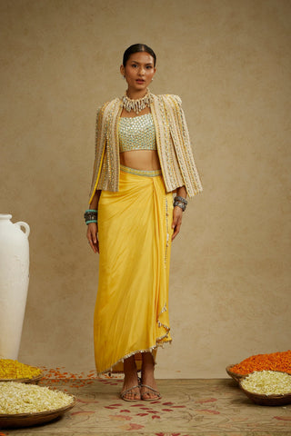 DANDELION EMBELLISHED JACKET PAIRED WITH EMBELLISHED BUSTIER AND HIGH SLIT SKIRT